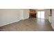 Spacious living room featuring wood floors, a fireplace, and sliding glass doors to the outside at 53404 W Candlelight Rd, Maricopa, AZ 85139