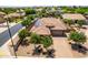 Aerial view of a tile roof home featuring solar panels and a paver driveway at 5446 S Sandstone Ct, Gilbert, AZ 85298
