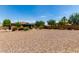 Large gravel backyard with a gazebo and plenty of space for entertainment at 5446 S Sandstone Ct, Gilbert, AZ 85298