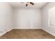 Empty bedroom with tile floor, neutral paint, and a bright window at 5446 S Sandstone Ct, Gilbert, AZ 85298