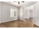 Empty bedroom with tile floor, neutral paint, and a bright window at 5446 S Sandstone Ct, Gilbert, AZ 85298