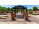 Backyard featuring a gazebo with decorative landscaping at 5446 S Sandstone Ct, Gilbert, AZ 85298