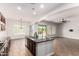 Bright kitchen featuring granite countertops, a large island, modern appliances, and tile flooring at 5446 S Sandstone Ct, Gilbert, AZ 85298