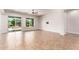 Spacious living room featuring tile floors, neutral paint, and sliding glass doors at 5446 S Sandstone Ct, Gilbert, AZ 85298