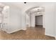 Spacious room featuring beautiful arched doorways and tile flooring at 5446 S Sandstone Ct, Gilbert, AZ 85298