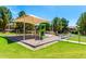 Community playground featuring a shade structure and various play equipment for children at 5446 S Sandstone Ct, Gilbert, AZ 85298