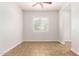 Empty room with tile floor, neutral paint, and a bright window at 5446 S Sandstone Ct, Gilbert, AZ 85298