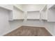 Walk-in closet featuring carpeted floors and built-in shelving at 5446 S Sandstone Ct, Gilbert, AZ 85298