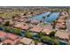 An aerial view of a lakefront community complete with boat docks and lush landscaping at 579 N Mondel Dr, Gilbert, AZ 85233