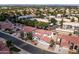 This bird's eye view shows a well-maintained neighborhood with tree-lined streets and Gathering homes at 579 N Mondel Dr, Gilbert, AZ 85233