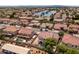 This aerial shows proximity to a peaceful lake, mature trees, and well-maintained yards at 579 N Mondel Dr, Gilbert, AZ 85233