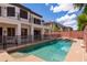 Backyard oasis with a sparkling pool, patio, and privacy fence, ideal for relaxation and entertaining at 579 N Mondel Dr, Gilbert, AZ 85233