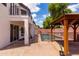 Backyard features covered patio and gazebo by the pool, perfect for entertaining and outdoor enjoyment at 579 N Mondel Dr, Gilbert, AZ 85233