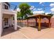 Backyard with a covered patio, gazebo, and a fenced in pool for safe outdoor enjoyment at 579 N Mondel Dr, Gilbert, AZ 85233
