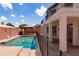 Relaxing backyard featuring a pool, gazebo, covered patio and desert landscaping, perfect for entertaining at 579 N Mondel Dr, Gilbert, AZ 85233