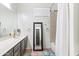 Bathroom showcasing tiled floors, single sink vanity, and a shower with curtain at 579 N Mondel Dr, Gilbert, AZ 85233