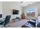 Comfortable bedroom with a nice window, TV, and carpet floors, perfect for relaxation at 579 N Mondel Dr, Gilbert, AZ 85233