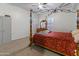 Cozy bedroom featuring carpet floors, a ceiling fan, and natural light at 579 N Mondel Dr, Gilbert, AZ 85233