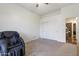 This bedroom includes a cozy chair, carpet floors, and a closet at 579 N Mondel Dr, Gilbert, AZ 85233