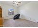 Bright bedroom featuring a massage chair, neutral carpet, and a sunlit window at 579 N Mondel Dr, Gilbert, AZ 85233