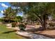 Picturesque community features lush landscaping, walking path and mature trees at 579 N Mondel Dr, Gilbert, AZ 85233