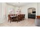 Bright dining room featuring a large table, plantation shutters, and beautiful tile flooring at 579 N Mondel Dr, Gilbert, AZ 85233