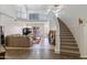 Grand foyer with a staircase leading to the second floor and an open concept floor plan at 579 N Mondel Dr, Gilbert, AZ 85233