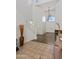 Bright foyer with tall ceilings, staircase, hardwood floors, and decorative chandelier create a welcoming entrance at 579 N Mondel Dr, Gilbert, AZ 85233