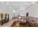 Spacious living room with high ceilings, a staircase, and views into the home's entryway at 579 N Mondel Dr, Gilbert, AZ 85233