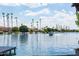 Picturesque waterfront scene featuring a lake with boats, lined with mature palm trees and luxurious homes at 579 N Mondel Dr, Gilbert, AZ 85233