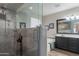 Bright bathroom featuring glass shower, soaking tub, and double vanity at 5924 W Shangri La Rd, Glendale, AZ 85304