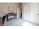 Neutral bedroom with a decorative table, a model ship, and a large closet at 5924 W Shangri La Rd, Glendale, AZ 85304