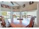 Bright dining area featuring a wood table set in front of large windows and decor at 5924 W Shangri La Rd, Glendale, AZ 85304
