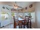 Bright dining area featuring a wood table set in front of large windows at 5924 W Shangri La Rd, Glendale, AZ 85304