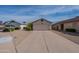 Traditional one-story home with low maintenance desert landscaping and an attached two-car garage at 5924 W Shangri La Rd, Glendale, AZ 85304