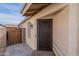 Close-up of the home's entryway showcasing a decorative security door and a stylish exterior light fixture at 5924 W Shangri La Rd, Glendale, AZ 85304