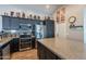 Well-equipped kitchen featuring sleek appliances, ample storage, and a large island for food preparation at 5924 W Shangri La Rd, Glendale, AZ 85304