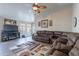 Bright, open living room with a comfortable sectional sofa, ceiling fan, and wood-look flooring at 5924 W Shangri La Rd, Glendale, AZ 85304