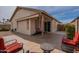 Back patio with tile floor, seating, and backyard access at 5924 W Shangri La Rd, Glendale, AZ 85304