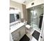 Modern bathroom boasts a walk-in shower, contemporary vanity, and stylish gray accents at 6920 E Beverly Ln, Scottsdale, AZ 85254