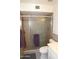 Bathroom featuring a glass-enclosed shower, tile surround, and modern fixtures at 6920 E Beverly Ln, Scottsdale, AZ 85254