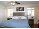 Comfortable bedroom with natural light, a ceiling fan, and neutral decor at 6920 E Beverly Ln, Scottsdale, AZ 85254