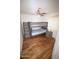 Hardwood floor bedroom equipped with a bunk bed, a ceiling fan and a wooden nightstand at 6920 E Beverly Ln, Scottsdale, AZ 85254