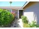 Charming entryway with 'Relax and Unwind' sign, plants, and a cozy, welcoming atmosphere at 6920 E Beverly Ln, Scottsdale, AZ 85254