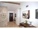Inviting entryway features a stone accent wall, tile flooring, and striking interior decor at 6920 E Beverly Ln, Scottsdale, AZ 85254