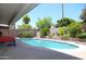 Beautiful backyard featuring a sparkling pool, privacy walls, and lush landscaping at 6920 E Beverly Ln, Scottsdale, AZ 85254