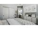 Bright bedroom features a large wardrobe, vanity, and neutral decor with a geometric blanket on the bed at 7221 E Eclipse Dr, Scottsdale, AZ 85266