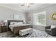 Comfortable bedroom with a cozy seating area, plush carpeting, and a large window with backyard view at 7221 E Eclipse Dr, Scottsdale, AZ 85266