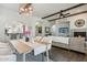 Elegant dining area with open floor plan, stylish lighting, and seamless transition to the living room at 7221 E Eclipse Dr, Scottsdale, AZ 85266