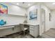 Bright office space with built-in desk, shelving, and stylish flooring at 7221 E Eclipse Dr, Scottsdale, AZ 85266